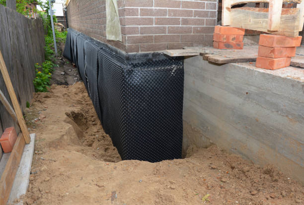 Happy homeowners after waterproofing job in Powell